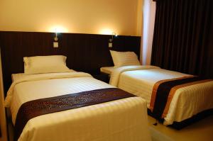Katil atau katil-katil dalam bilik di Hotel Yankin