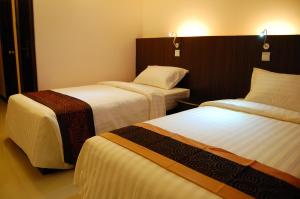 Katil atau katil-katil dalam bilik di Hotel Yankin