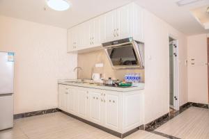 Cucina o angolo cottura di Guangzhou Pengman Apartment Zhengjia Huanshi Branch
