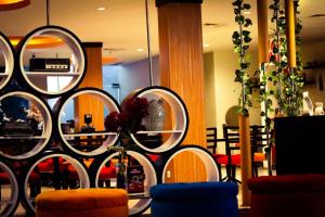a room with a bunch of wine barrels at News Hotel Waru Sidoarjo in Waru