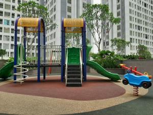 a playground with a slide in a city at Best Price 2BR Apartment @ Midtown Residence By Travelio in Tangerang