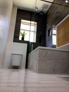a room with a potted plant and a window at Double Bedroom, Kings Lynn, New Renovated Bathroom in Kings Lynn