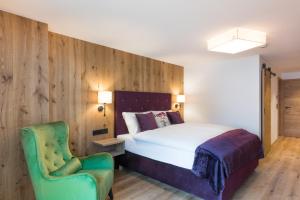 Łóżko lub łóżka w pokoju w obiekcie Boutiquehotel die Alpbacherin 4 Sterne Superior