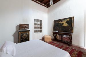 Posteľ alebo postele v izbe v ubytovaní Villa Hacienda del Batán