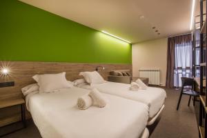 Postel nebo postele na pokoji v ubytování Pic Maià Mountain Hotel