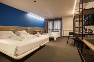 Postel nebo postele na pokoji v ubytování Pic Maià Mountain Hotel