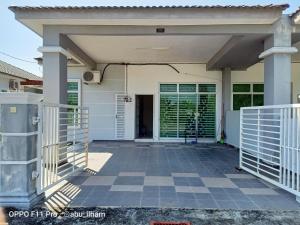a front porch of a house with a gate at Ilham Imani Homestay in Kampung Gurun