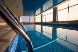 an empty swimming pool in a building at AlmaBagi Hotel&Villas in Quba