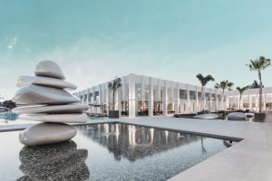 a rendering of a building with a pile of rocks at Paloma Finesse Side in Side