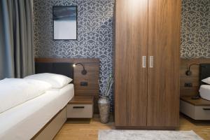 Łóżko lub łóżka w pokoju w obiekcie MyApartments Vienna