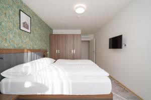Łóżko lub łóżka w pokoju w obiekcie MyApartments Vienna