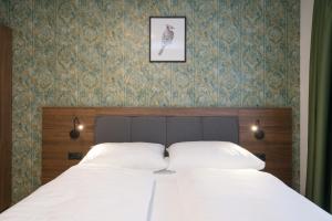 Łóżko lub łóżka w pokoju w obiekcie MyApartments Vienna