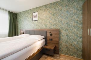 Łóżko lub łóżka w pokoju w obiekcie MyApartments Vienna