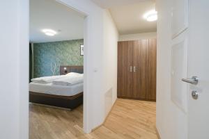 Łóżko lub łóżka w pokoju w obiekcie MyApartments Vienna