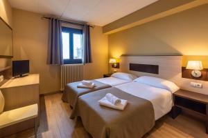 Säng eller sängar i ett rum på Hotel Port 1730