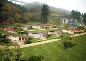 a group of buildings in a field of grass at M13 Hotel in Riol