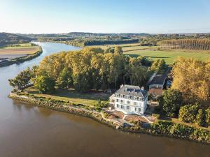 an aerial view of a house on an island in a river at Chateau du Bec du Gave in Port-de-Lanne