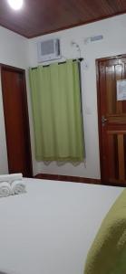 Posteľ alebo postele v izbe v ubytovaní Pousada Baía do Sol Vilatur