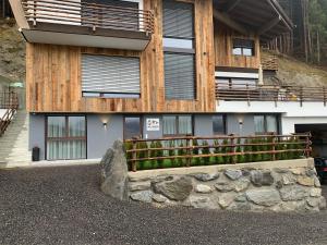 a building with a fence in front of it at Apart Wexwood in Hart im Zillertal