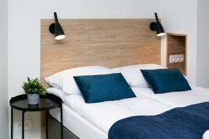 Posteľ alebo postele v izbe v ubytovaní Warsaw City Center Apartments by Noclegi Renters