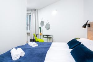 Posteľ alebo postele v izbe v ubytovaní Warsaw City Center Apartments by Noclegi Renters