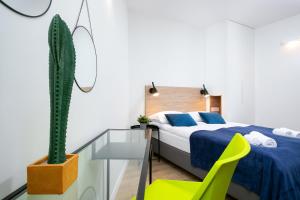 Posteľ alebo postele v izbe v ubytovaní Warsaw City Center Apartments by Noclegi Renters