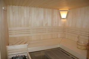 a sauna with a bench and a light in it at Residenz Nr.6 in Zapfendorf
