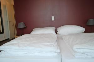 Uma cama ou camas num quarto em Gasthaus zum Ochsen