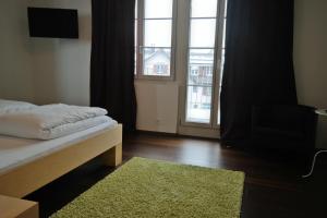 Postel nebo postele na pokoji v ubytování Gasthaus zum Ochsen