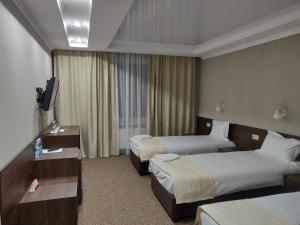 Postel nebo postele na pokoji v ubytování Sofievsky Posad Hotel