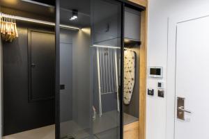 a glass closet in a room with a door at TatryTop Rezydencja Zakopiańska SPA in Zakopane +45 photos