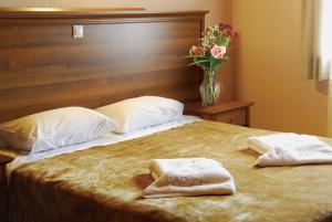 
Ένα ή περισσότερα κρεβάτια σε δωμάτιο στο Karyon Apartments 
