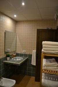 a bathroom with a sink and a mirror at Carataunas House Alpujarra in Carataunas