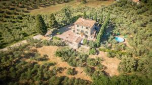 an aerial view of a house on a hill with trees at Villa La Casa del Re in Le Piazze