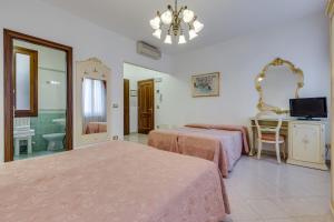 Postel nebo postele na pokoji v ubytování Hotel Bernardi Semenzato