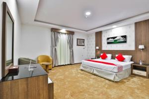 Postel nebo postele na pokoji v ubytování شقق نجمة نوارة للشقق المخدومة