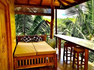a room with a bench and a table and a table and a tableablish at Tranquality Chalets in Tangalle