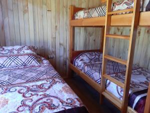 Postel nebo postele na pokoji v ubytování Paraíso Liumalla Lodge