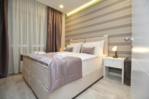 Postel nebo postele na pokoji v ubytování PLATINUM ROOMS butique hotel