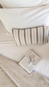 A bed or beds in a room at Erytha Hotel & Resort Chios