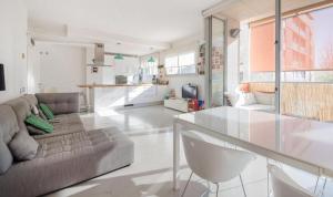 a living room with a couch and a glass table at Magnificent apartment close to the beach in Barcelona