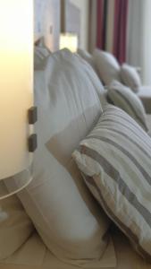 A bed or beds in a room at Erytha Hotel & Resort Chios