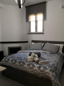 A bed or beds in a room at B&B I SIKULI
