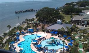 una vista aérea de una piscina en un resort en St Simons Island Banana House - 5 Min to Beach!, en Mallory Park