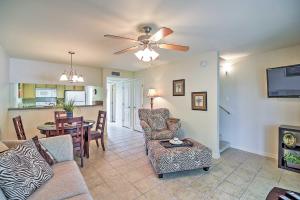 a living room with a couch and chairs and a table at Ocean Springs Condo in Waterfront Resort! in Ocean Springs