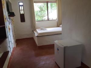 Postel nebo postele na pokoji v ubytování Imbassaí Pousada Hostel Lujimba
