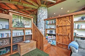 a living room with wooden walls and a book shelf at Dragonwood Castle on Waterfront with Stunning View in Prospect Harbor