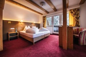 Postel nebo postele na pokoji v ubytování Hotel Sonnenheim