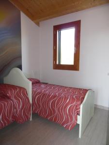 Ένα ή περισσότερα κρεβάτια σε δωμάτιο στο Ferienhaus direkt am Meer mit Wallbox für Elektroautos