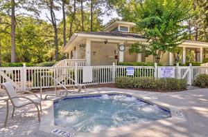 a hot tub in front of a house at Walk to Beach Resort-Style Hilton Head Condo! in Hilton Head Island